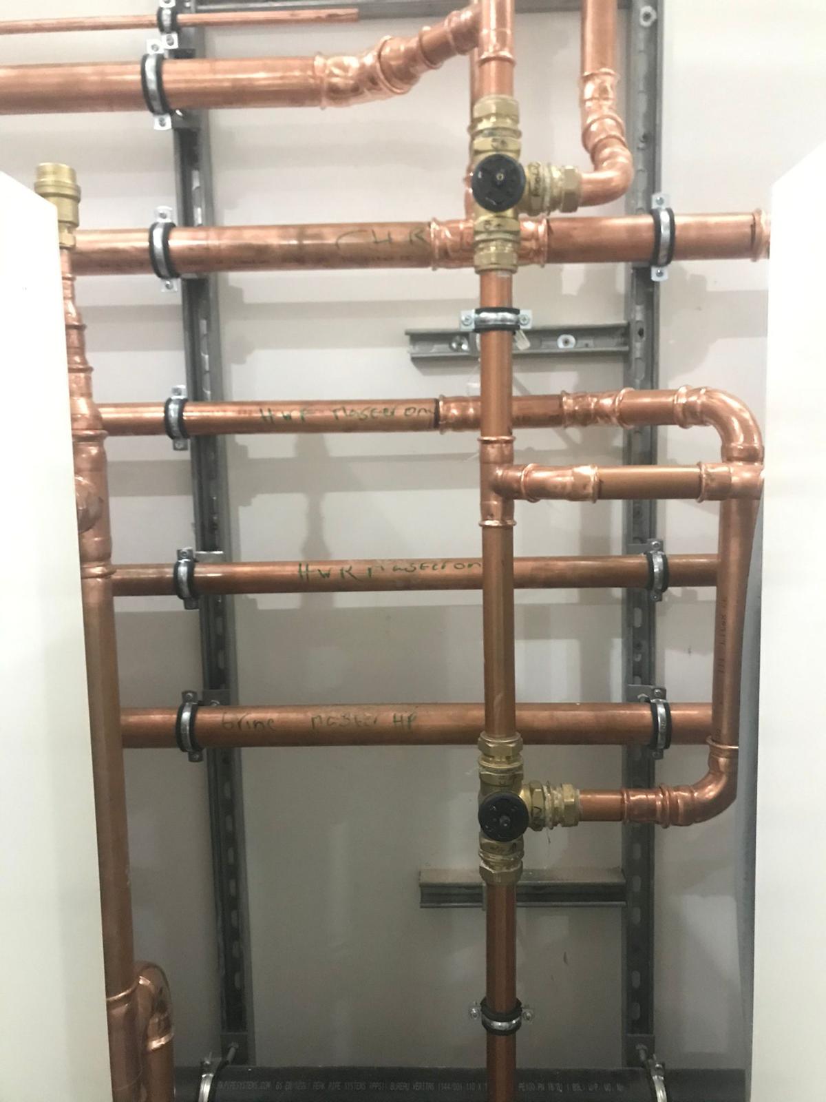 Labelled copper pipework array