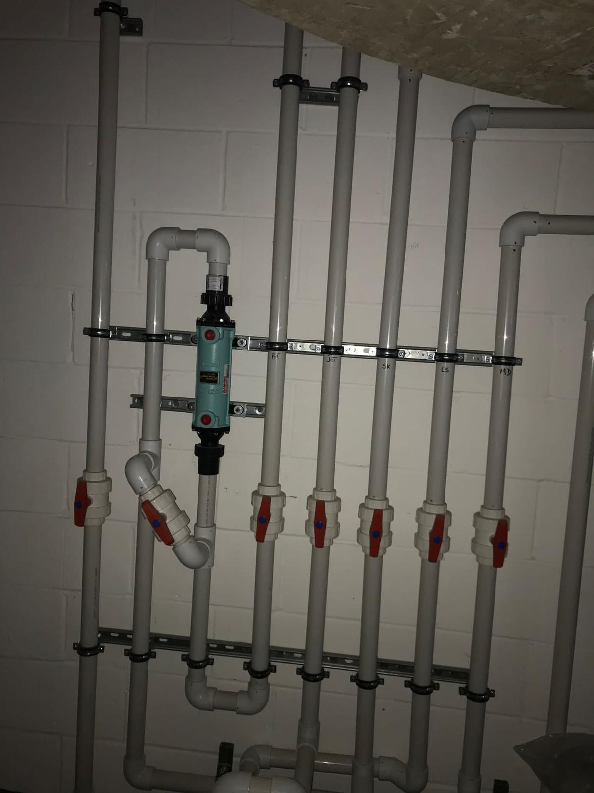Labelled PVC pipework with isolation valves
