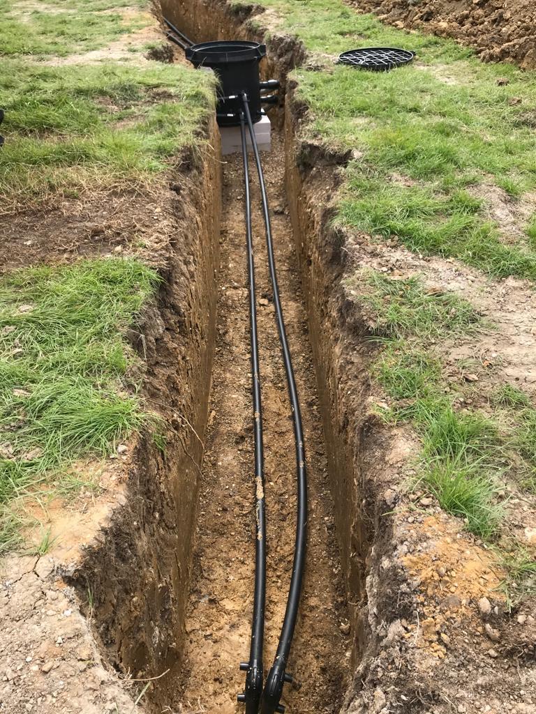 Ground loop trench with pipework